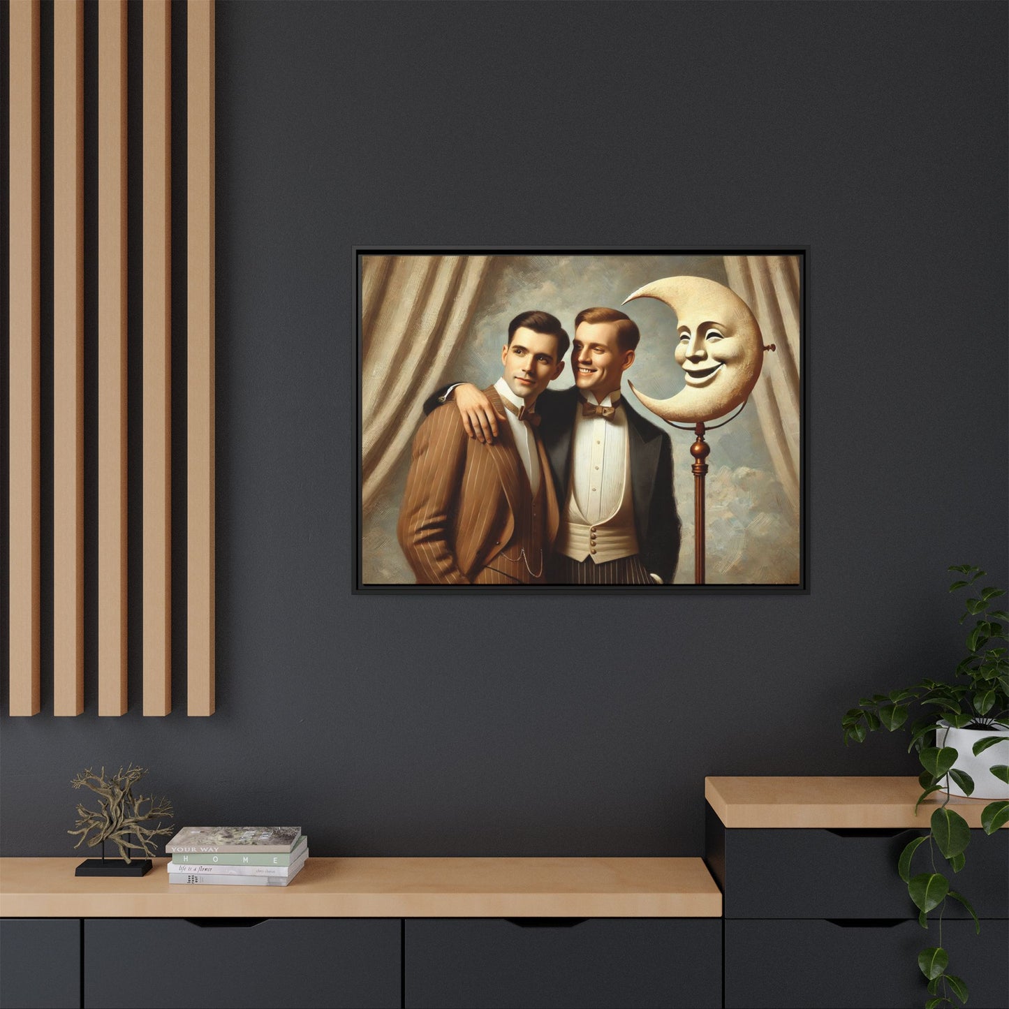 Framed matte canvas artwork of two men in vintage tuxedos standing beside a crescent moon prop. This piece reclaims LGBTQ+ representation lost to bias and honors everyday moments of affection and connection once absent from historical archives.