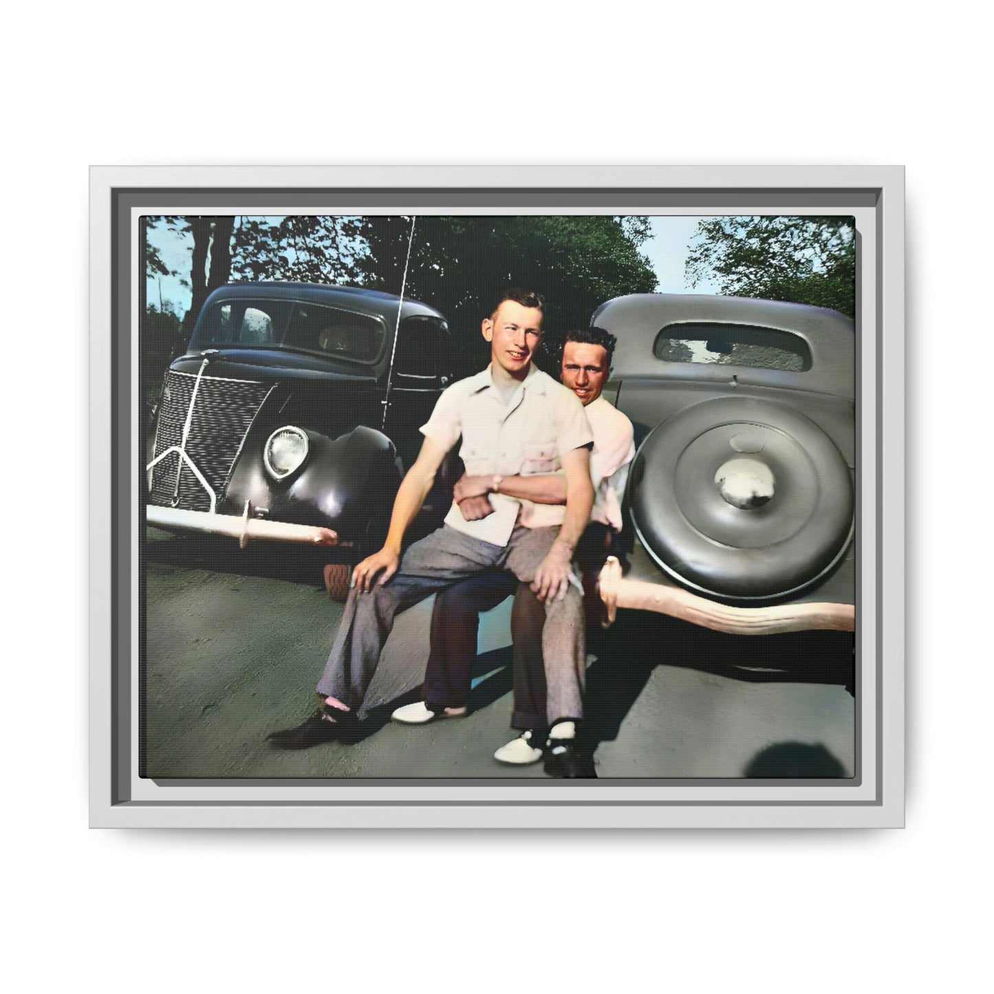 Restored vintage photograph of Andrew and Eugene seated on a classic car bumper in 1930s Lincoln, Nebraska. Framed matte canvas print celebrating LGBTQ+ history, love, and timeless companionship. Gay Couple