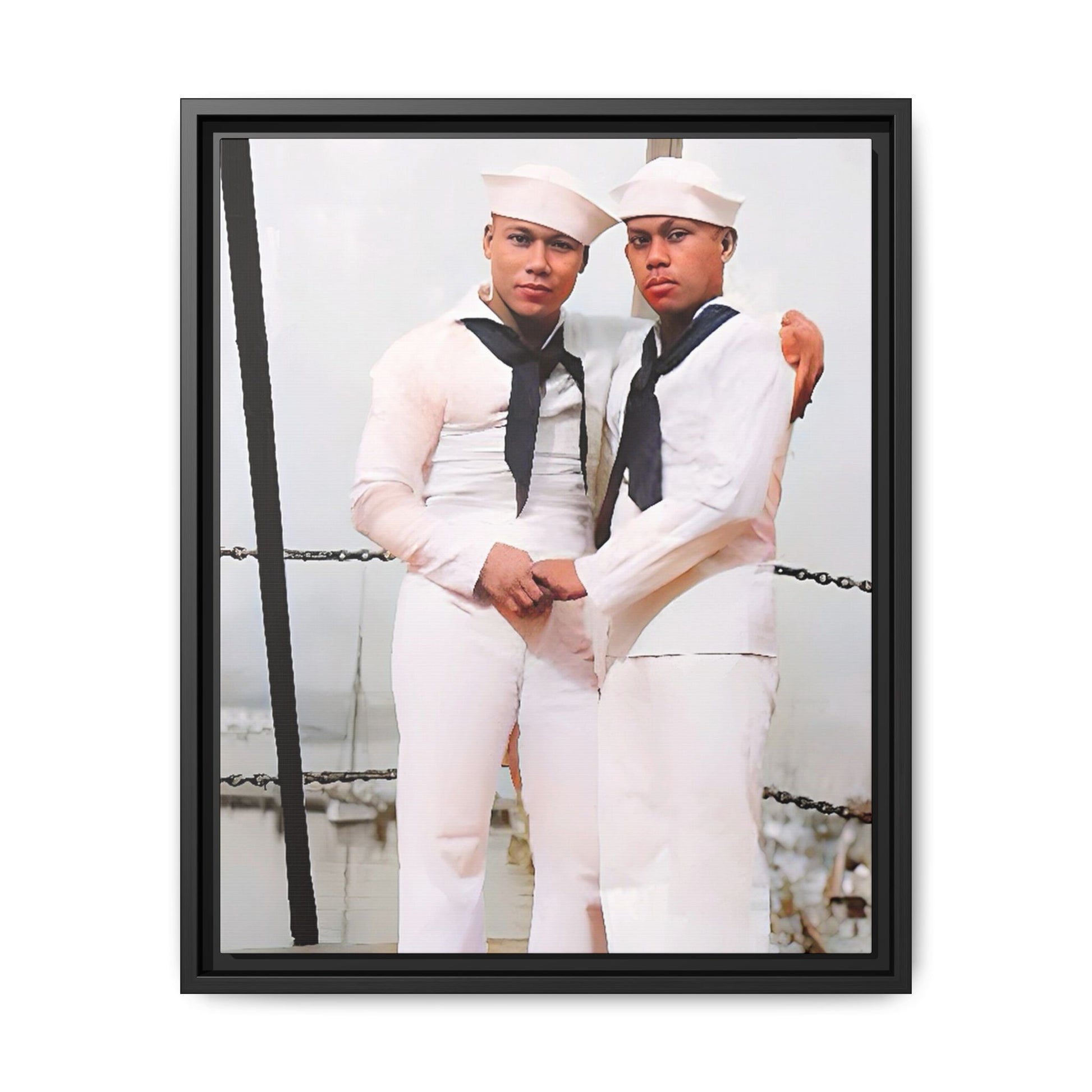 A restored vintage photograph of two Navy sailors standing together aboard a naval ship at Apra Harbor, Guam. Dressed in crisp white uniforms, their hands gently clasped, the image captures a quiet moment of strength, devotion, and LGBTQ+ military history.