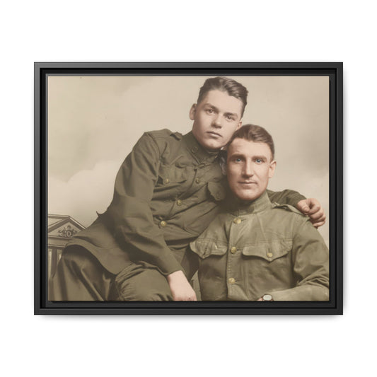 Historic photograph of two uniformed figures in seated portrait composition