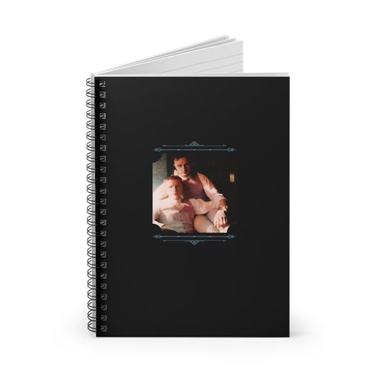 Colorized vintage LGBTQ photo of two men in a tender embrace on a matte black spiral notebook cover