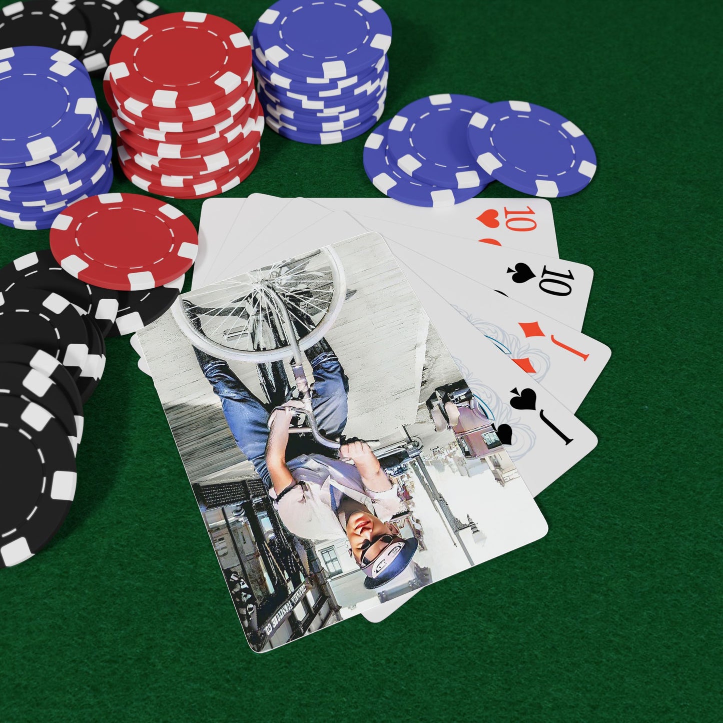 Vintage photo of a young man riding a bicycle through an early 20th-century city street, exuding confidence and freedom.