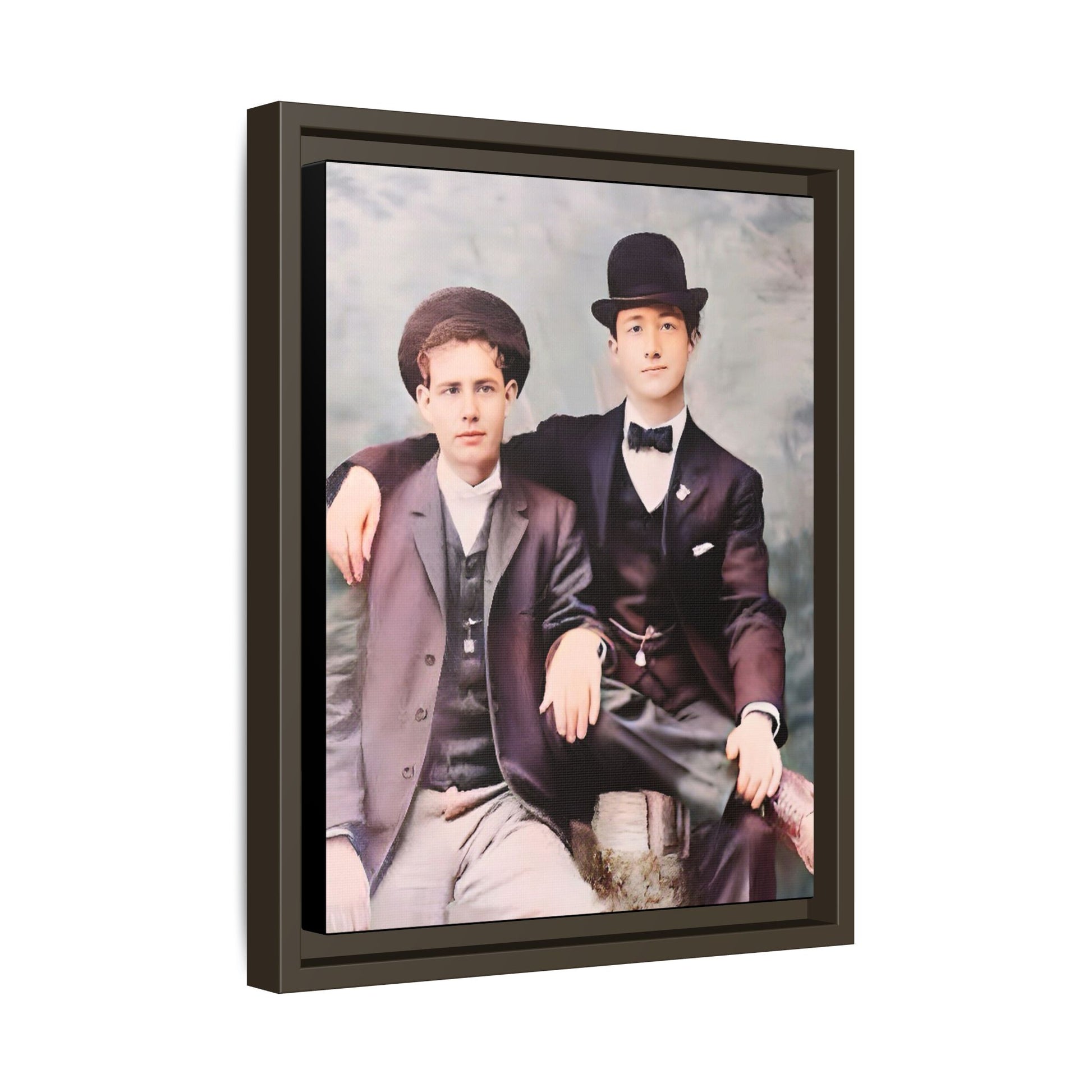 A stunningly restored early 20th-century portrait of Francis and Fai in Santa Barbara, California. Dressed in elegant bowler hats and classic suits, the two men share a poised yet deeply connected moment. The soft pastel tones and refined attire highlight a timeless love story, celebrating LGBTQ+ history and authentic companionship. Gay Couple