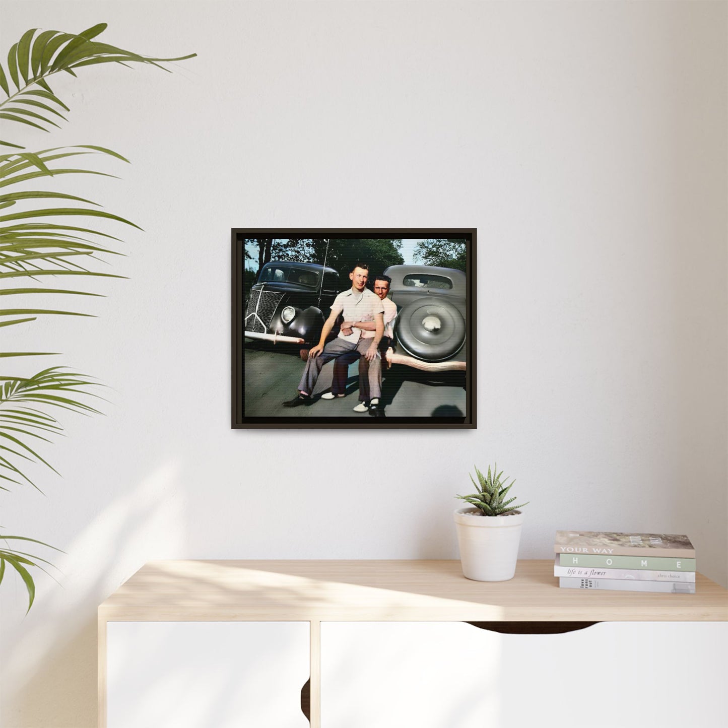 Restored vintage photograph of Andrew and Eugene seated on a classic car bumper in 1930s Lincoln, Nebraska. Framed matte canvas print celebrating LGBTQ+ history, love, and timeless companionship. Gay Couple