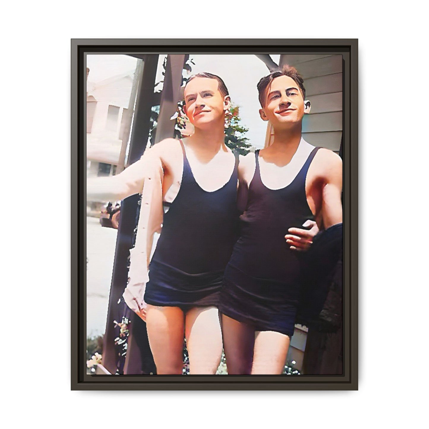 A beautifully restored vintage beach photo of two friends, Lee and Clifford, in classic black swimsuits, walking along Ocean Grove, New Jersey. Their smiles and relaxed body language capture the carefree joy of 1920s summer days, set against a charming coastal backdrop. Gay Couple