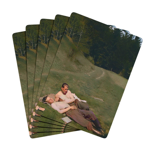 Vintage WWII photo of two soldiers reclining together on a hillside, symbolizing Queer love and resilience during wartime.