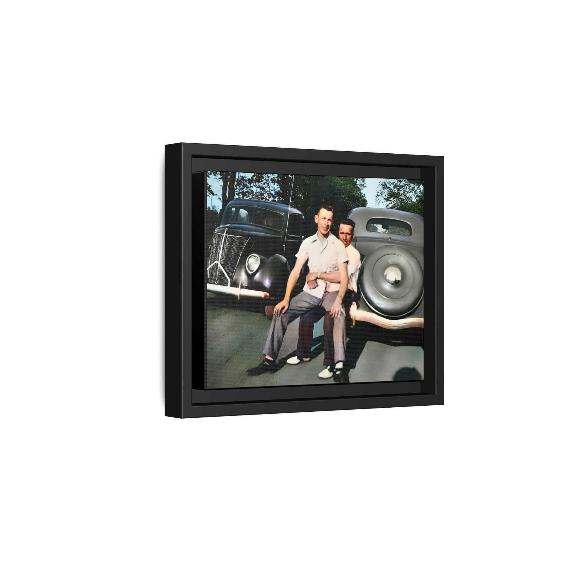 Restored vintage photograph of Andrew and Eugene seated on a classic car bumper in 1930s Lincoln, Nebraska. Framed matte canvas print celebrating LGBTQ+ history, love, and timeless companionship. Gay Couple