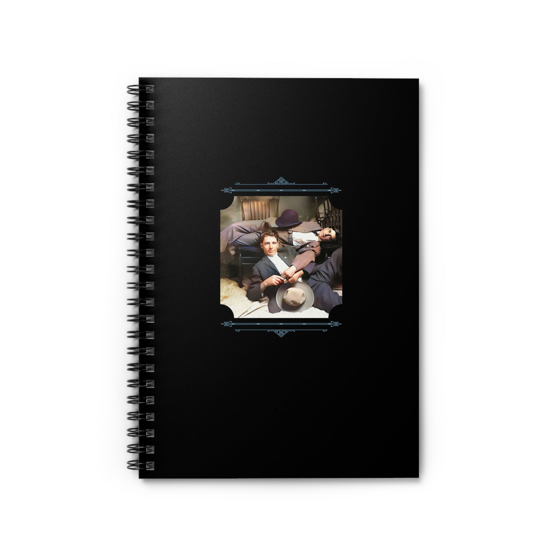 Spiral notebook featuring a vintage photo of two young men in suits lounging together in a cozy bedroom.