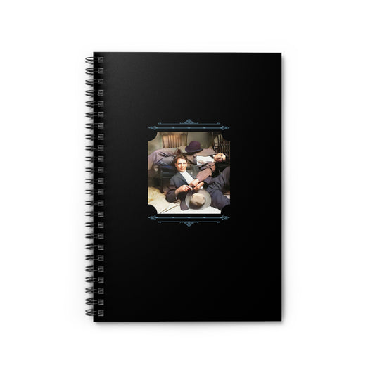 Spiral notebook featuring a vintage photo of two young men in suits lounging together in a cozy bedroom.