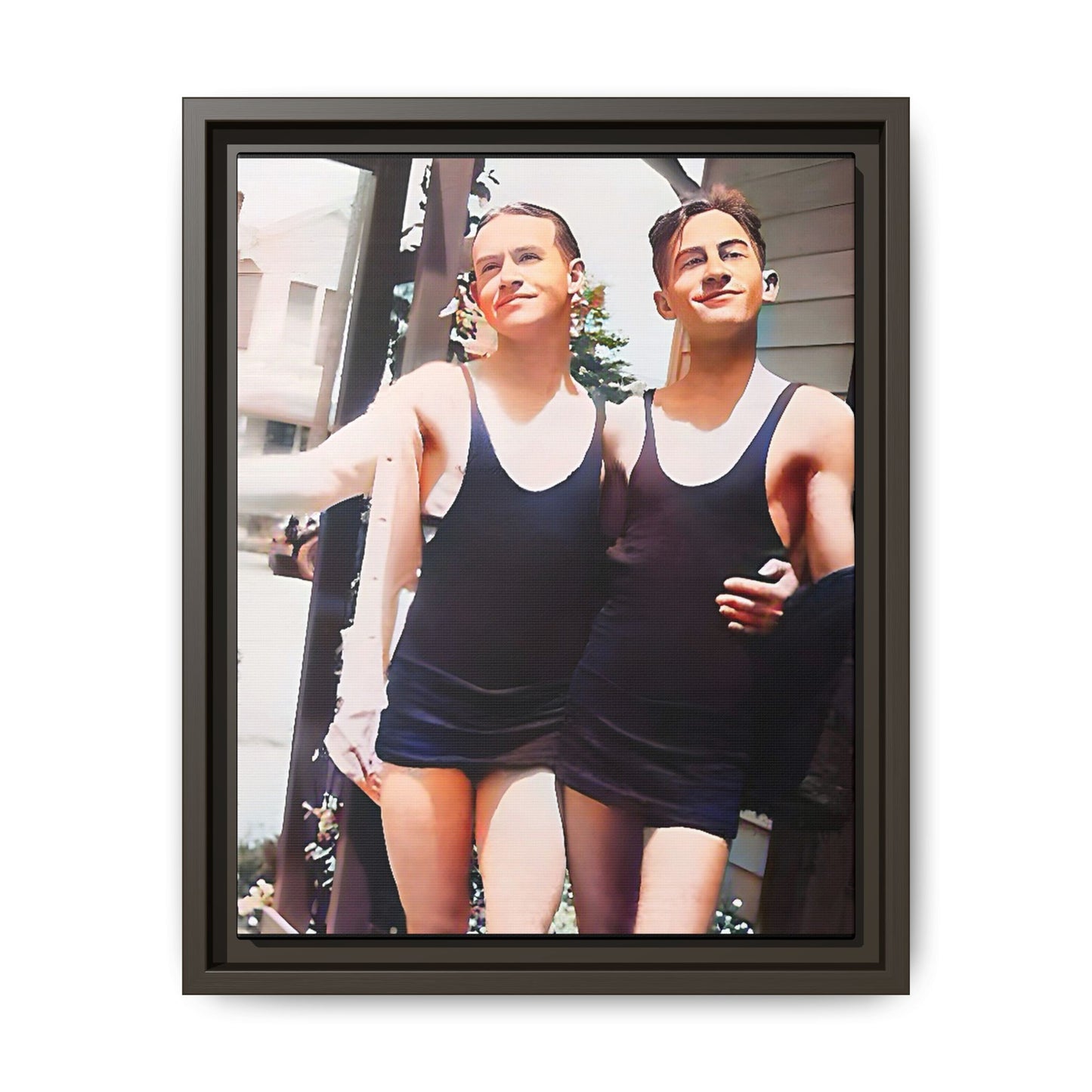 A beautifully restored vintage beach photo of two friends, Lee and Clifford, in classic black swimsuits, walking along Ocean Grove, New Jersey. Their smiles and relaxed body language capture the carefree joy of 1920s summer days, set against a charming coastal backdrop. Gay Couple