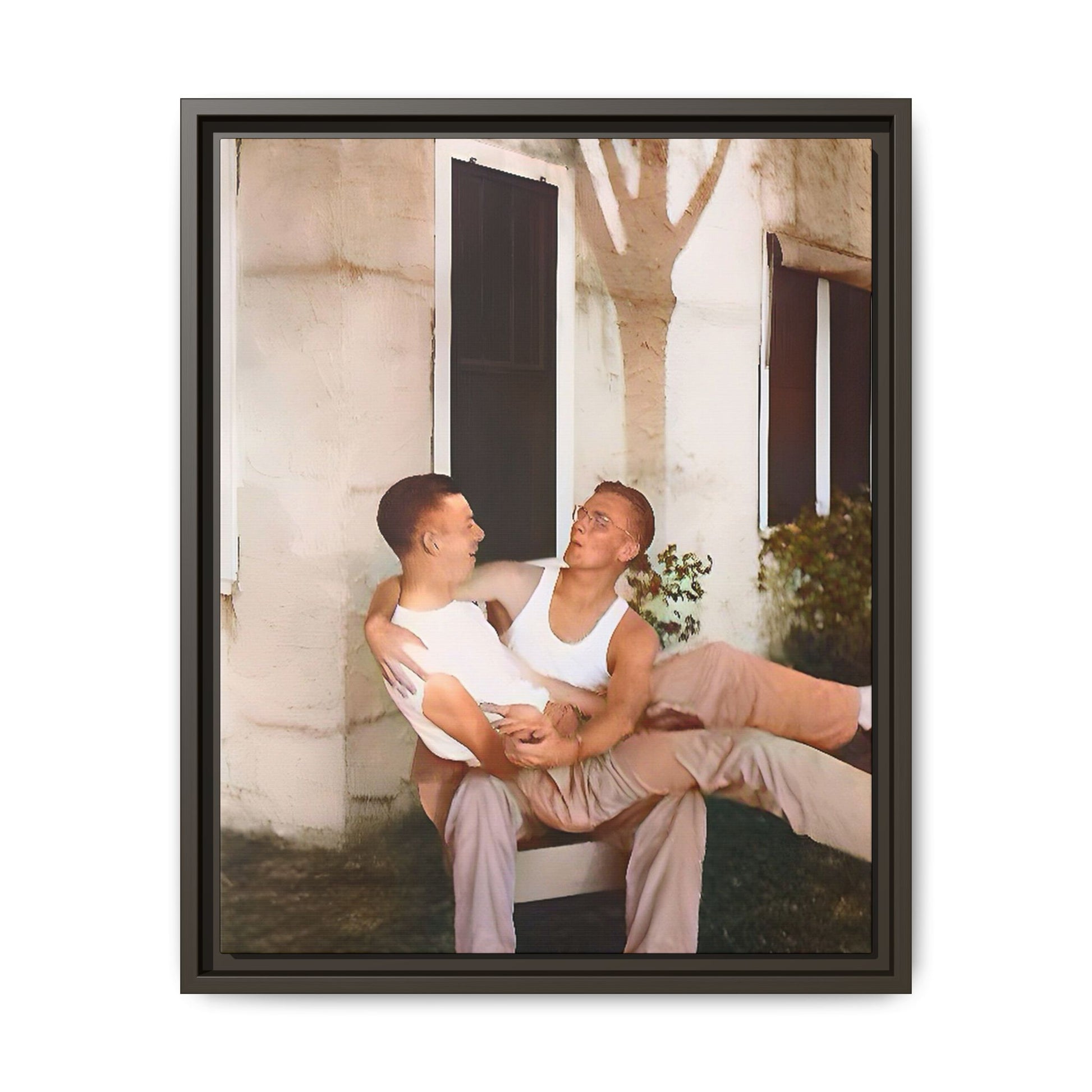 A vintage photograph of Donald and Joseph, two men embracing with joy in 1930s New Orleans. Captured in warm sunlight against a rustic Louisiana home, this intimate portrait celebrates LGBTQ+ history, love, and the beauty of unspoken connection. Gay Couple