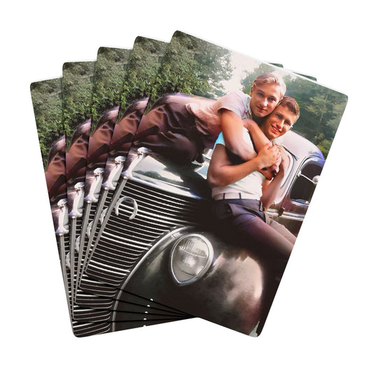A restored vintage photo of a gay couple embracing on a classic 1930s car, capturing a hidden Queer love story.