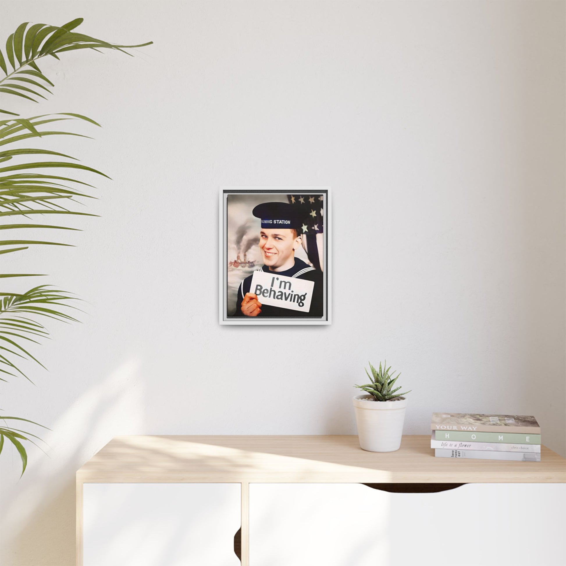 A vintage U.S. Navy sailor portrait featuring Carl at the Washington Navy Yard, grinning while holding a card reading "I'm Behaving." This framed matte canvas print is a charming mix of humor and military history, perfect for collectors and veterans.