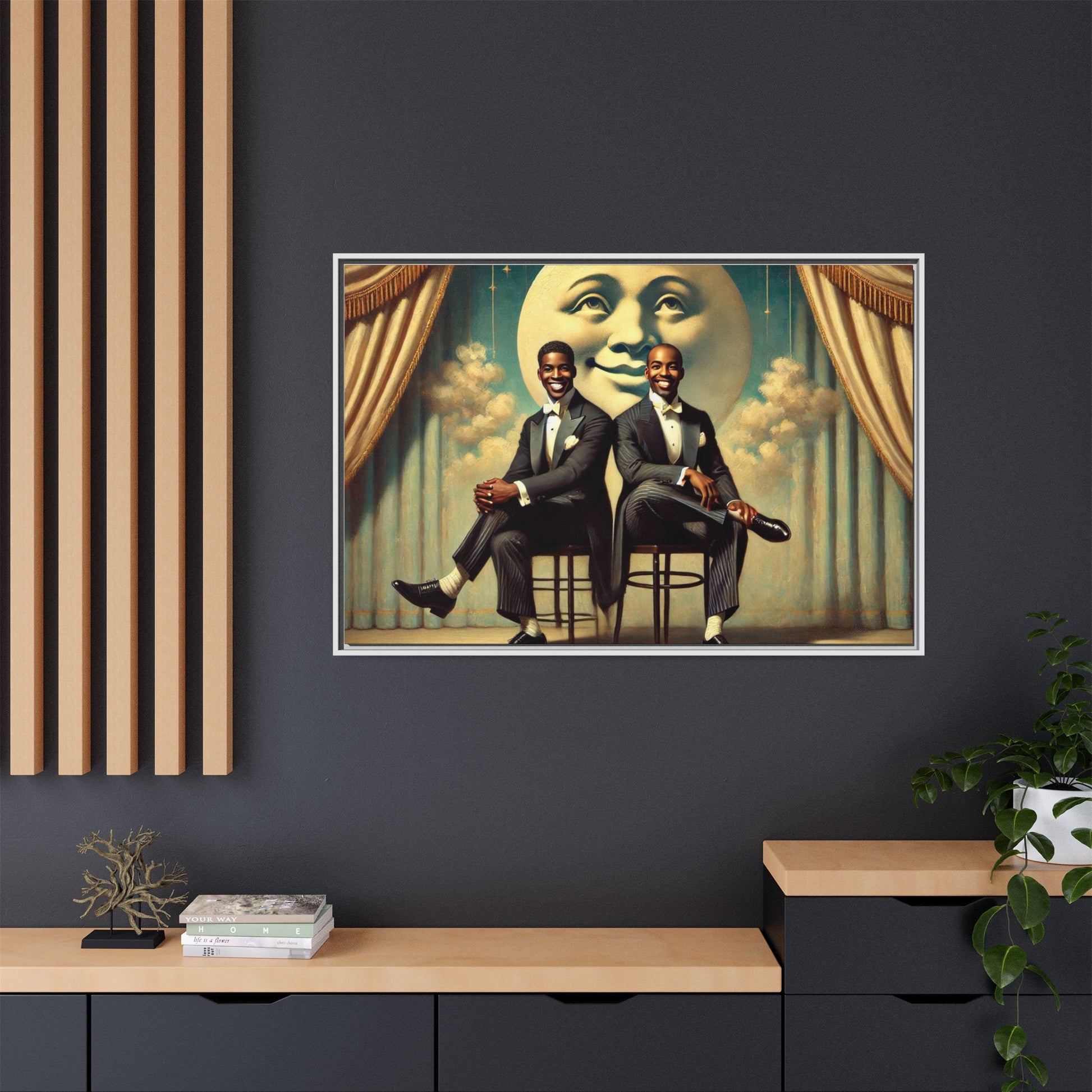 Framed vintage-style portrait of two Black men in tuxedos seated under a smiling crescent moon prop with golden curtains and cloud backdrop. This restored matte canvas honors lost LGBTQ history and reclaims early 20th-century queer representation with pride.