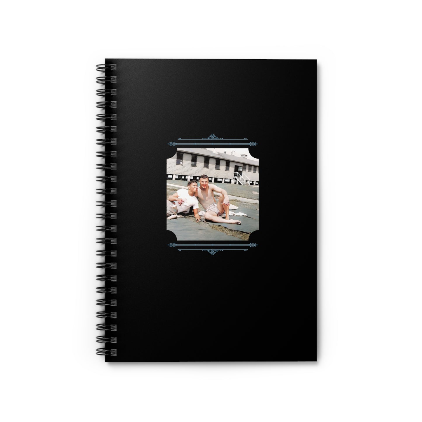 Spiral notebook with a restored vintage WWII photo of three men relaxing on an army base, one African American.