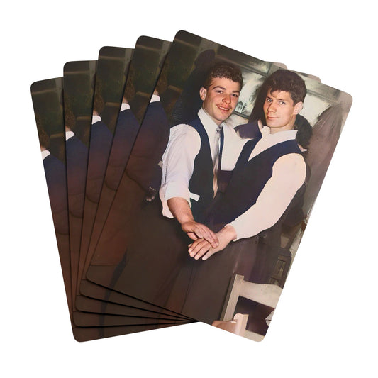 Vintage photo of a stylish gay couple in formal attire, clasping hands in a dance, symbolizing Queer love and joy.