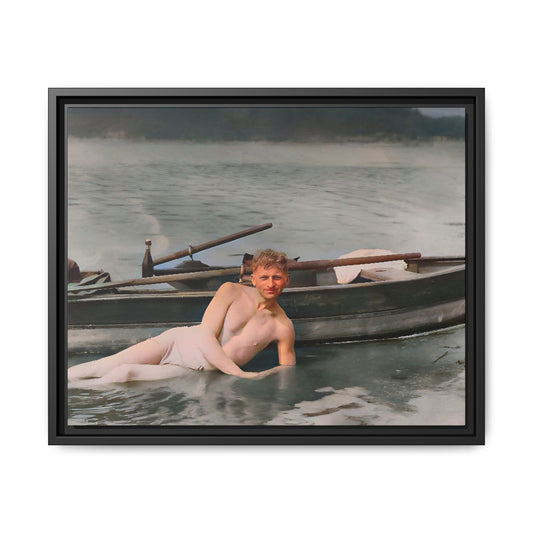 Restored vintage photo of Claude reclining by a rowboat on a calm lake in early 1900s Green Bay, Wisconsin. Framed matte canvas art celebrating serenity, history, and individuality.