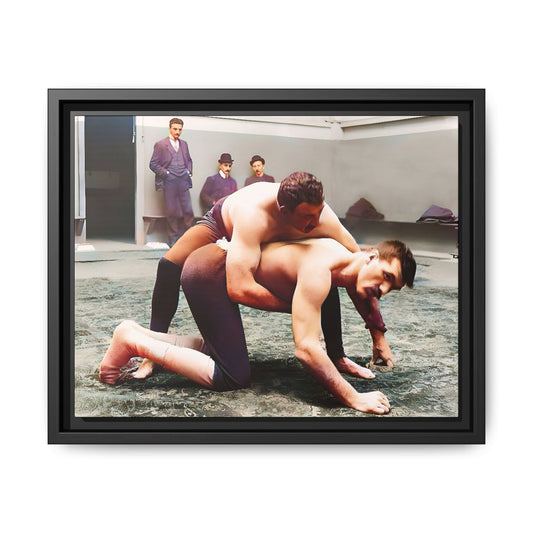A framed vintage wrestling photograph on matte canvas featuring a Victorian-era match at Love’s Wrestling Club in Plumstead, UK, capturing strength and camaraderie.