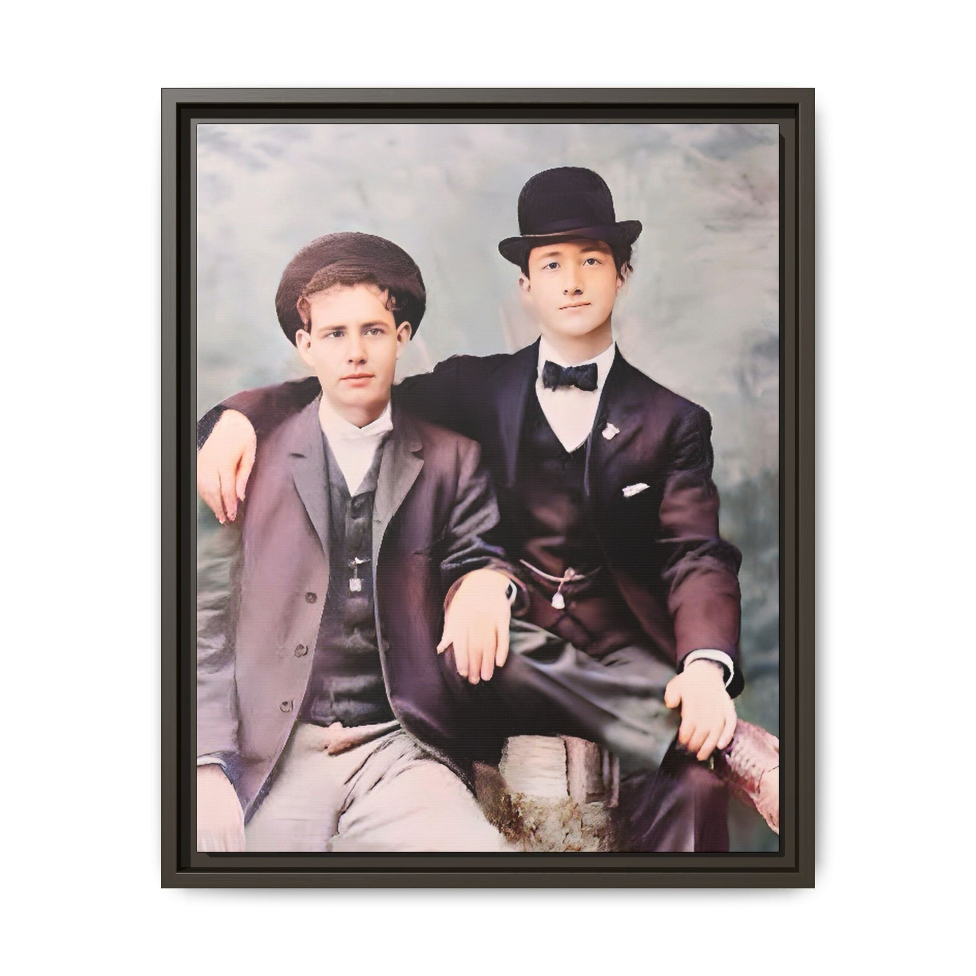 A stunningly restored early 20th-century portrait of Francis and Fai in Santa Barbara, California. Dressed in elegant bowler hats and classic suits, the two men share a poised yet deeply connected moment. The soft pastel tones and refined attire highlight a timeless love story, celebrating LGBTQ+ history and authentic companionship. Gay Couple
