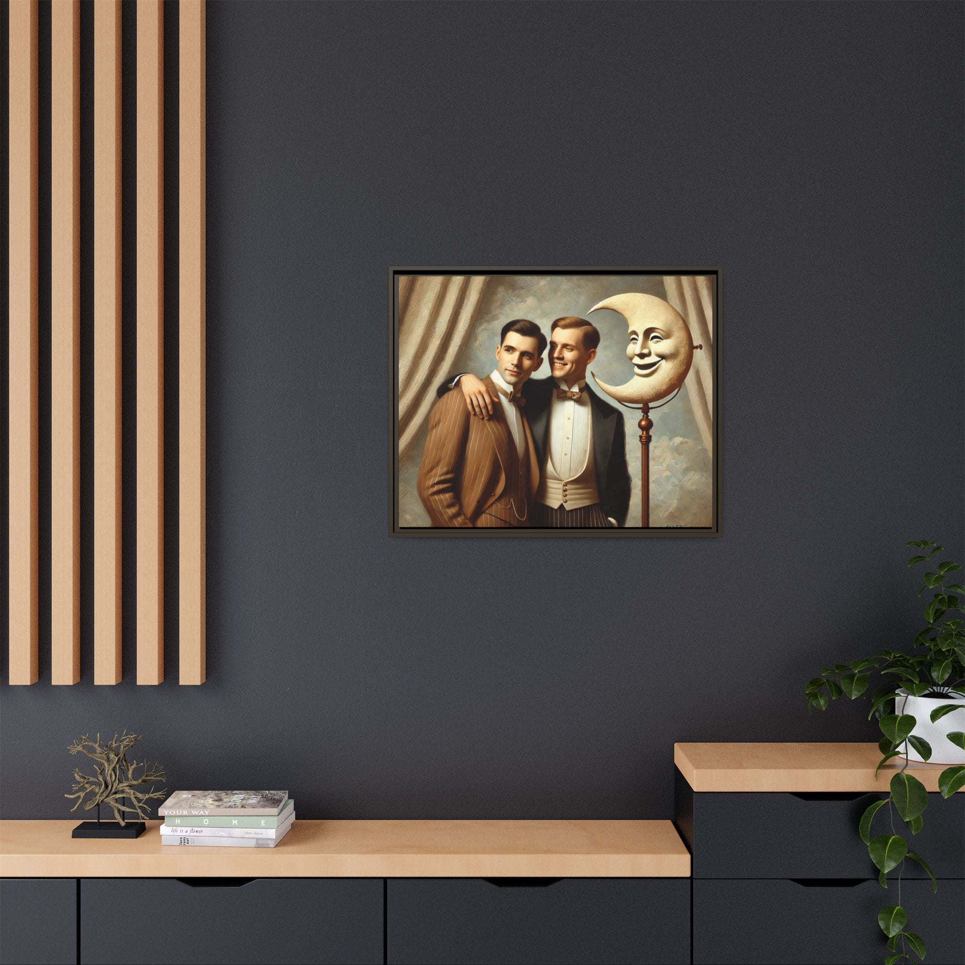 Framed matte canvas artwork of two men in vintage tuxedos standing beside a crescent moon prop. This piece reclaims LGBTQ+ representation lost to bias and honors everyday moments of affection and connection once absent from historical archives.