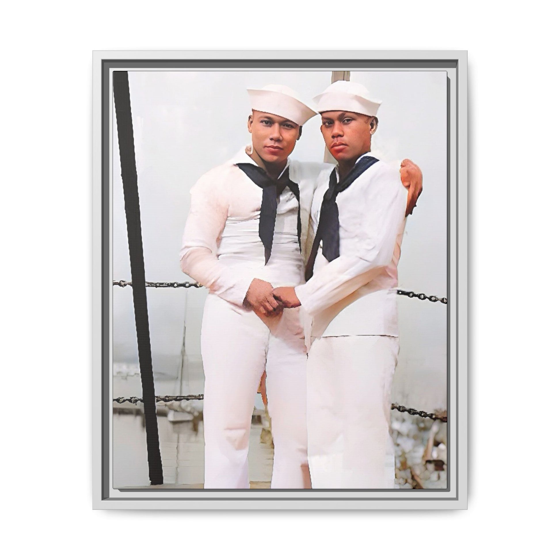 A restored vintage photograph of two Navy sailors standing together aboard a naval ship at Apra Harbor, Guam. Dressed in crisp white uniforms, their hands gently clasped, the image captures a quiet moment of strength, devotion, and LGBTQ+ military history.