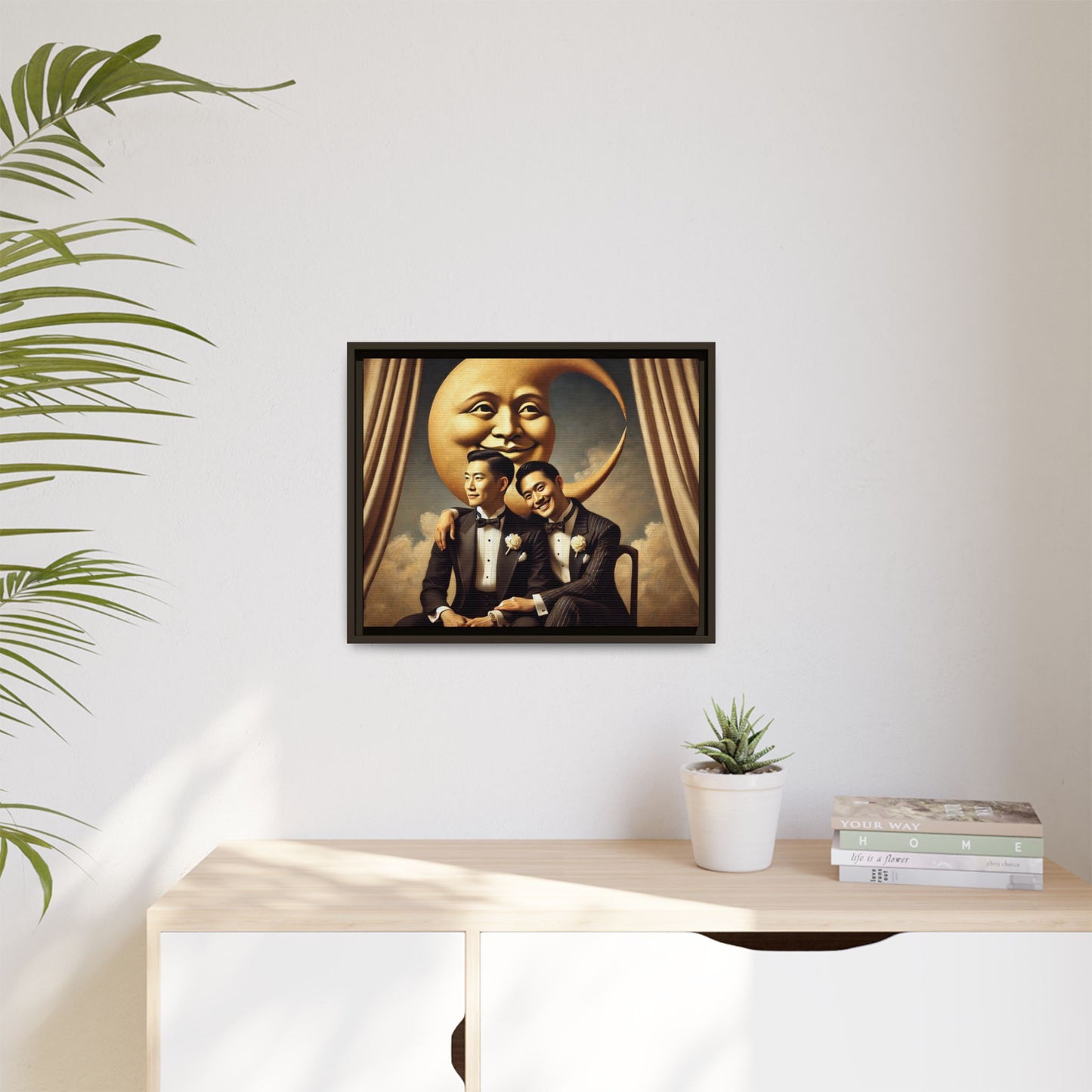 Vintage-inspired artwork of a romantic gay Asian couple in tuxedos sitting affectionately beneath a smiling crescent moon prop, surrounded by vintage stage curtains and dreamy clouds. A reclaimed queer narrative from the Man In The Moon series.