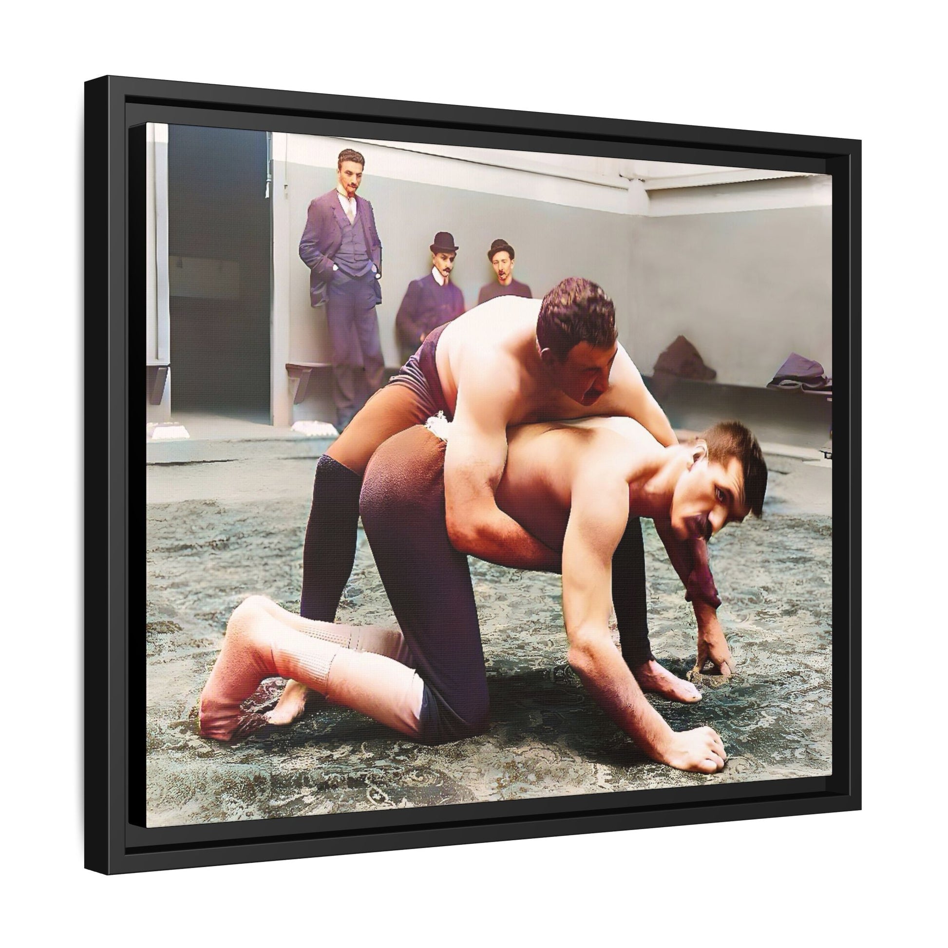 A framed vintage wrestling photograph on matte canvas featuring a Victorian-era match at Love’s Wrestling Club in Plumstead, UK, capturing strength and camaraderie.