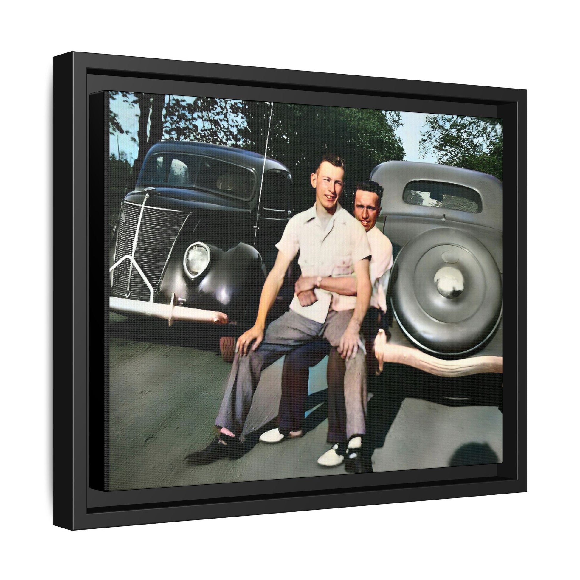 Restored vintage photograph of Andrew and Eugene seated on a classic car bumper in 1930s Lincoln, Nebraska. Framed matte canvas print celebrating LGBTQ+ history, love, and timeless companionship. Gay Couple