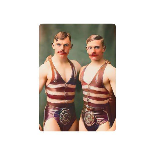 Vintage photo of two muscular men in striped wrestling singlets, standing closely, symbolizing strength, camaraderie, and LGBTQ+ history.