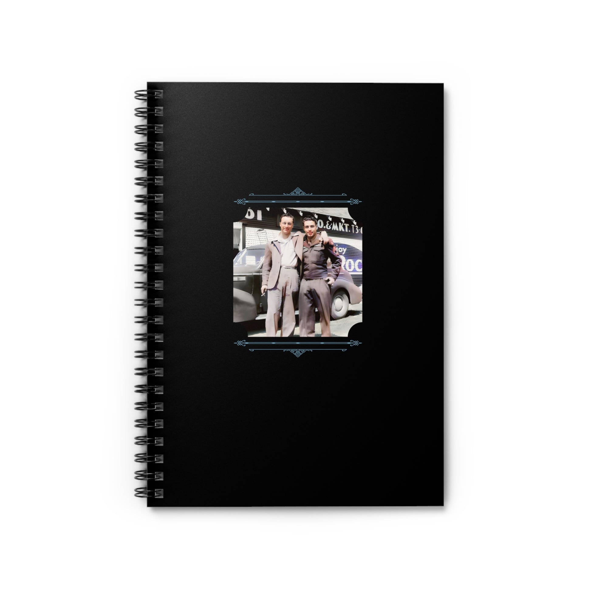 Notebook featuring a vintage WWII-era photo of a gay couple—soldier and civilian—outside a mechanic garage.