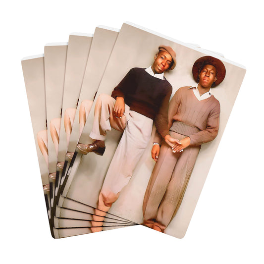 Vintage photo of a Black gay couple in Memphis, dressed in stylish mid-century fashion, symbolizing Queer love and defiance.