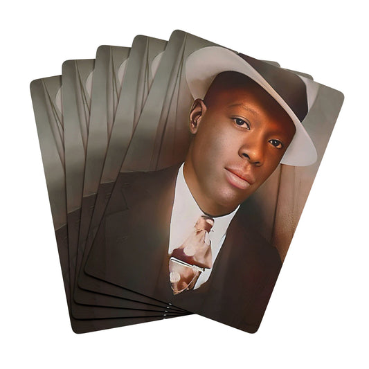 Vintage photo of a stylish African American man in a fedora and suit, seated in a classic mid-century photo booth.