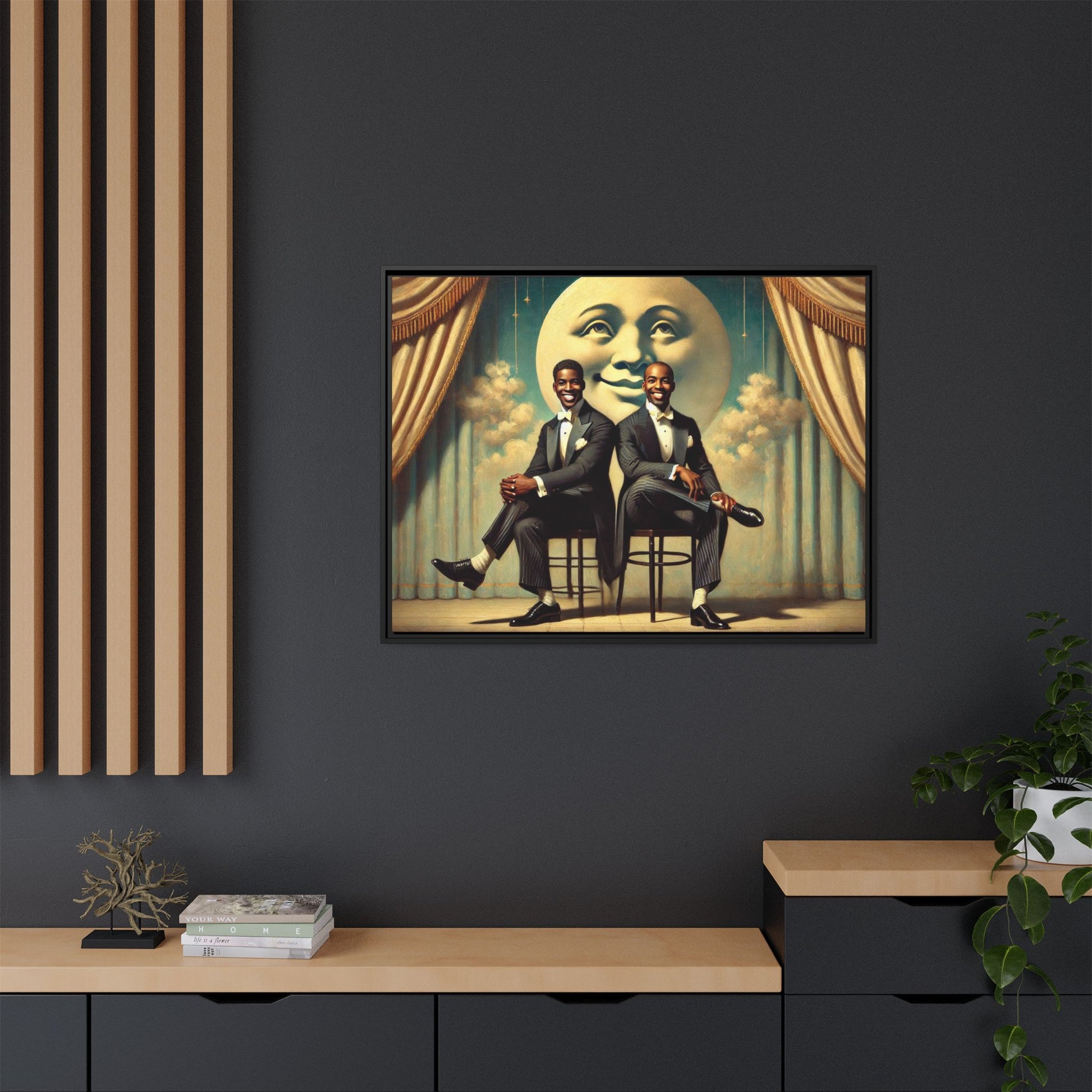 Framed vintage-style portrait of two Black men in tuxedos seated under a smiling crescent moon prop with golden curtains and cloud backdrop. This restored matte canvas honors lost LGBTQ history and reclaims early 20th-century queer representation with pride.