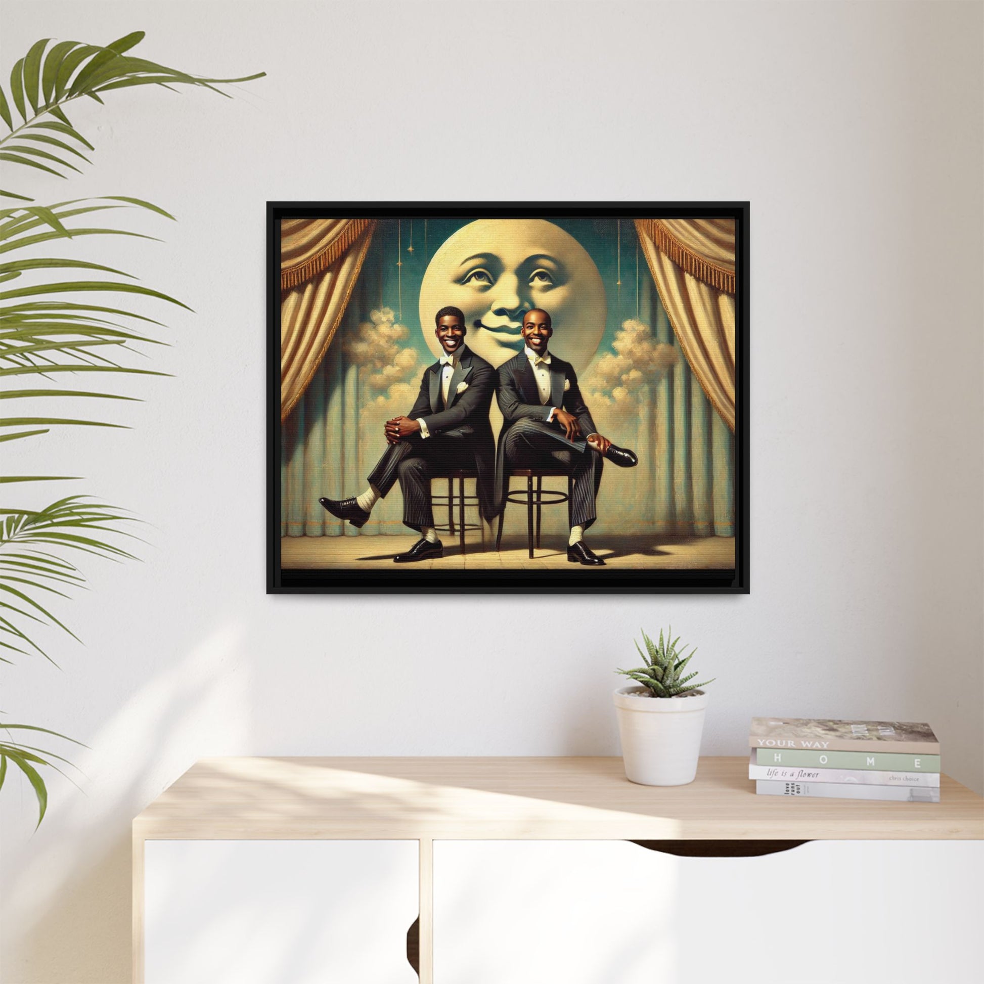 Framed vintage-style portrait of two Black men in tuxedos seated under a smiling crescent moon prop with golden curtains and cloud backdrop. This restored matte canvas honors lost LGBTQ history and reclaims early 20th-century queer representation with pride.