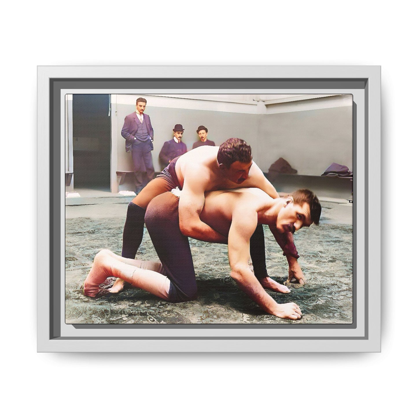 A framed vintage wrestling photograph on matte canvas featuring a Victorian-era match at Love’s Wrestling Club in Plumstead, UK, capturing strength and camaraderie.
