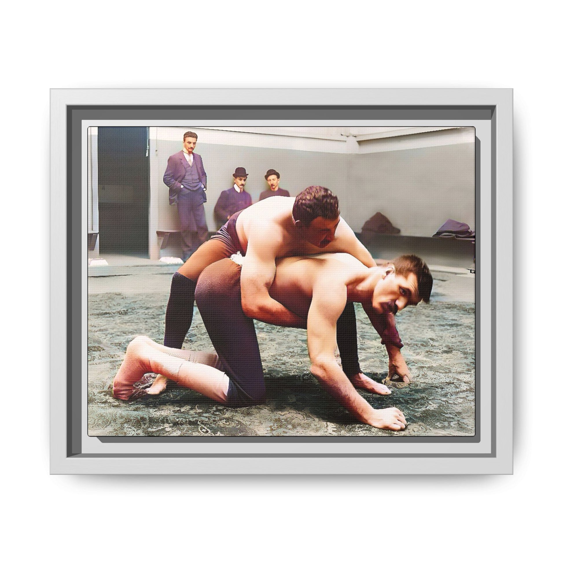A framed vintage wrestling photograph on matte canvas featuring a Victorian-era match at Love’s Wrestling Club in Plumstead, UK, capturing strength and camaraderie.