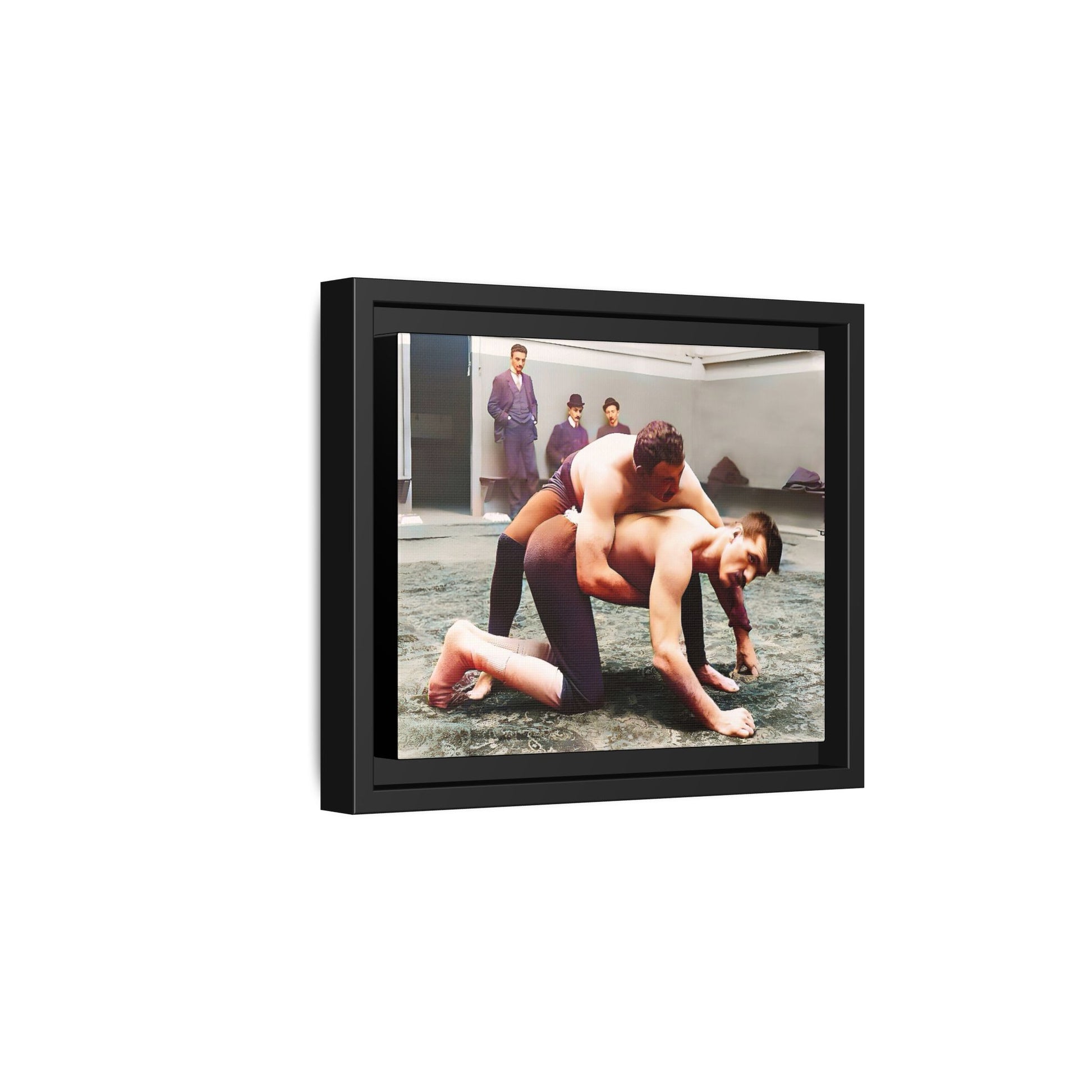 A framed vintage wrestling photograph on matte canvas featuring a Victorian-era match at Love’s Wrestling Club in Plumstead, UK, capturing strength and camaraderie.