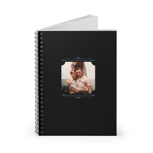 Black spiral notebook cover with a joyful vintage photo of a young gay couple hugging in mid-century attire