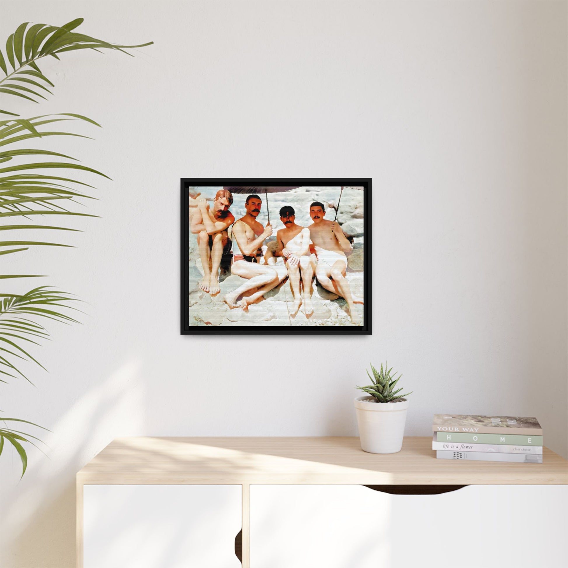 A nostalgic vintage beach photograph from Herring Cove Beach, Provincetown, MA. This framed canvas print captures four men in a relaxed summer moment, perfect for coastal home decor or as an LGBTQ+ history tribute.