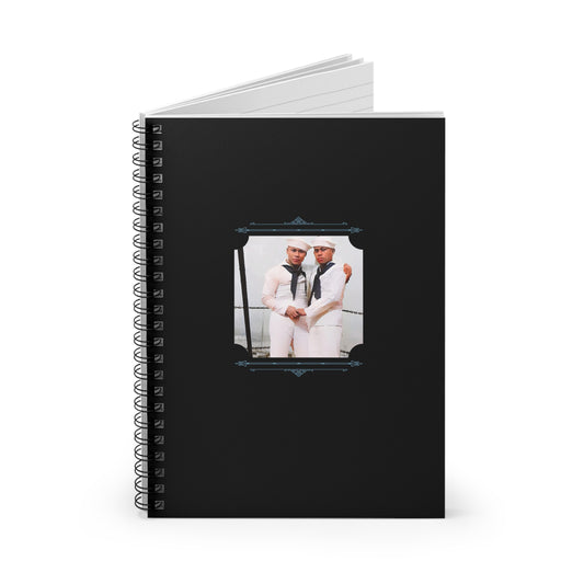 Colorized historical image of two Puerto Rican men in Navy uniforms embracing aboard a ship during WWII, on notebook cover