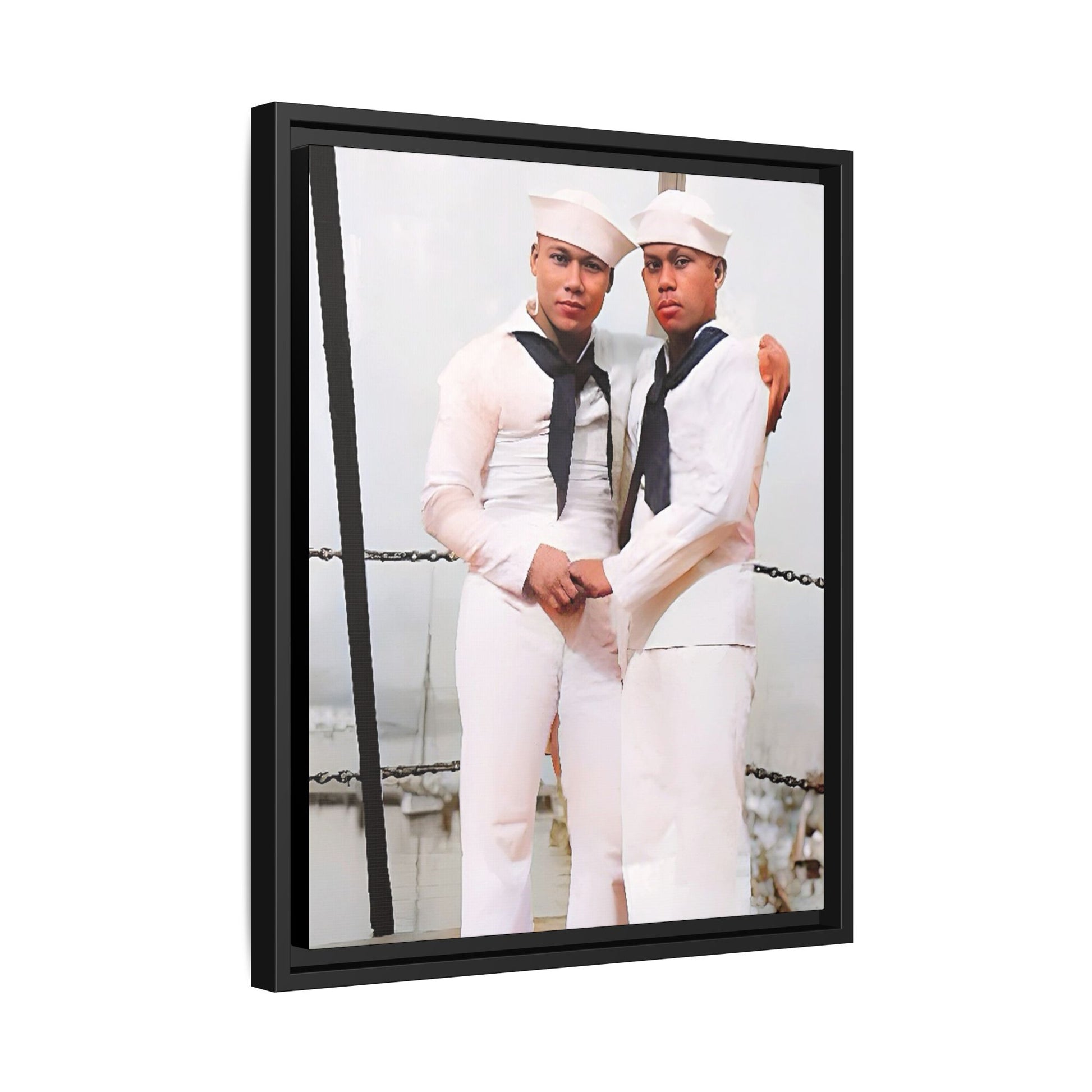 A restored vintage photograph of two Navy sailors standing together aboard a naval ship at Apra Harbor, Guam. Dressed in crisp white uniforms, their hands gently clasped, the image captures a quiet moment of strength, devotion, and LGBTQ+ military history.