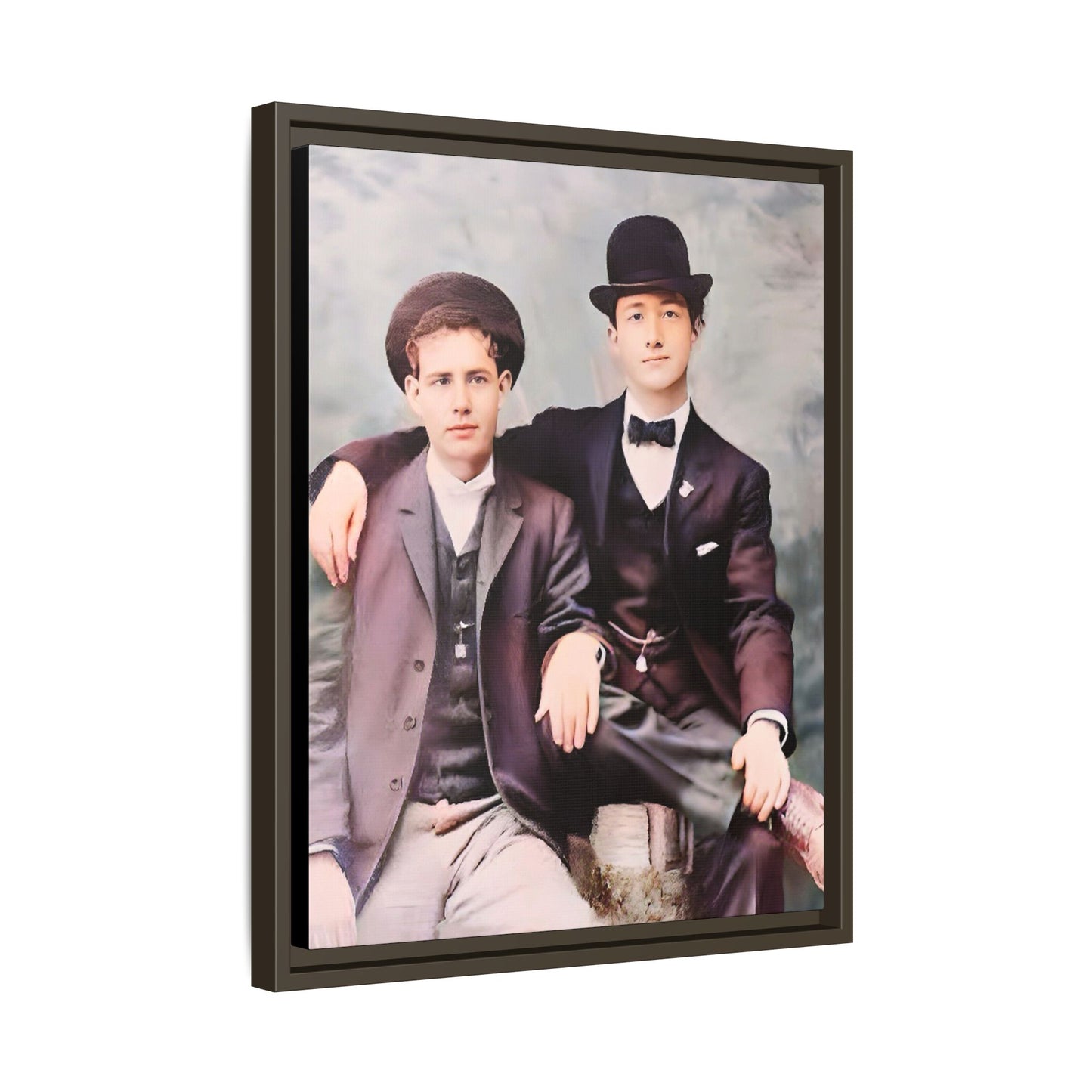 A stunningly restored early 20th-century portrait of Francis and Fai in Santa Barbara, California. Dressed in elegant bowler hats and classic suits, the two men share a poised yet deeply connected moment. The soft pastel tones and refined attire highlight a timeless love story, celebrating LGBTQ+ history and authentic companionship. Gay Couple