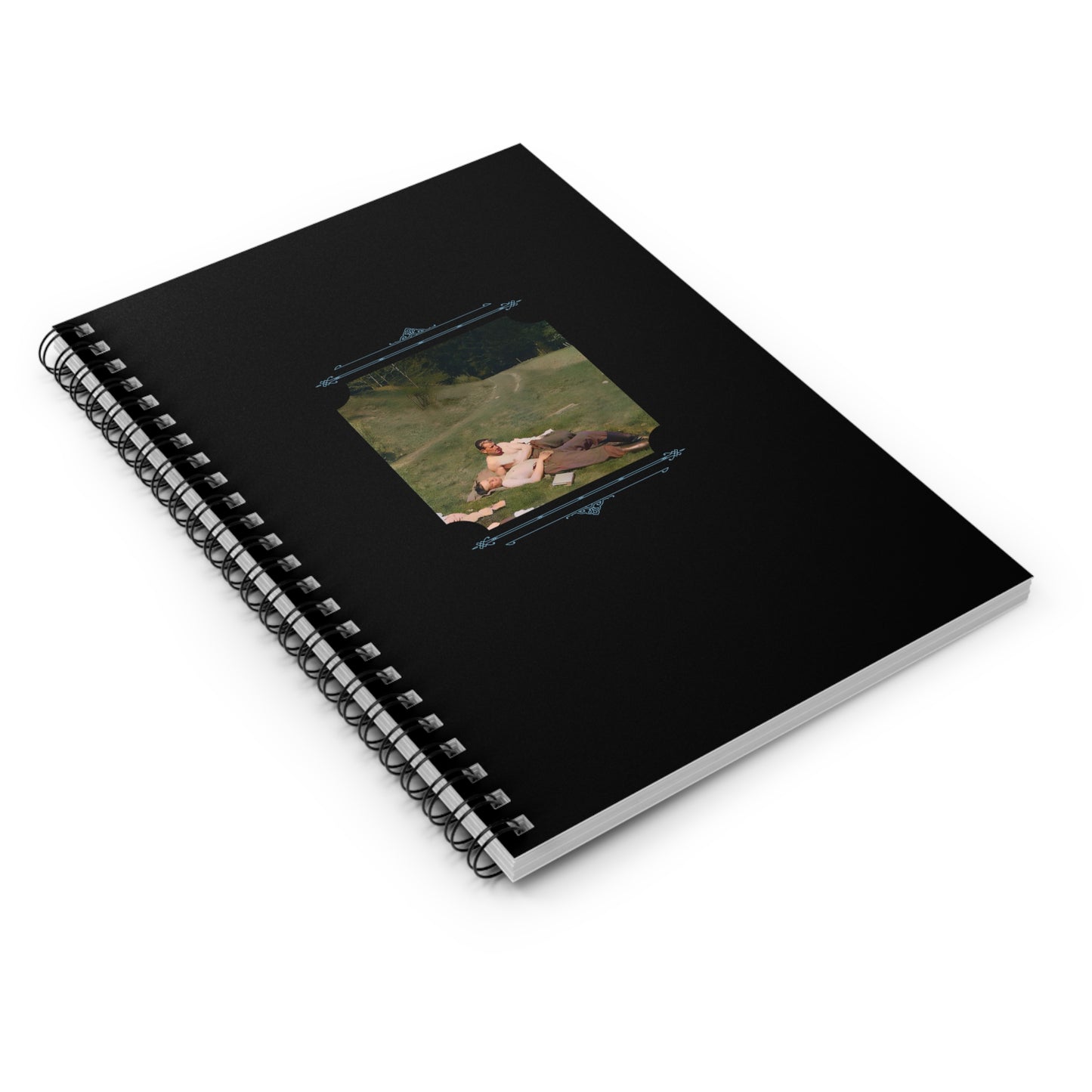 Vintage photo of WWII soldiers embracing in a field, colorized and printed on a ruled spiral notebook.