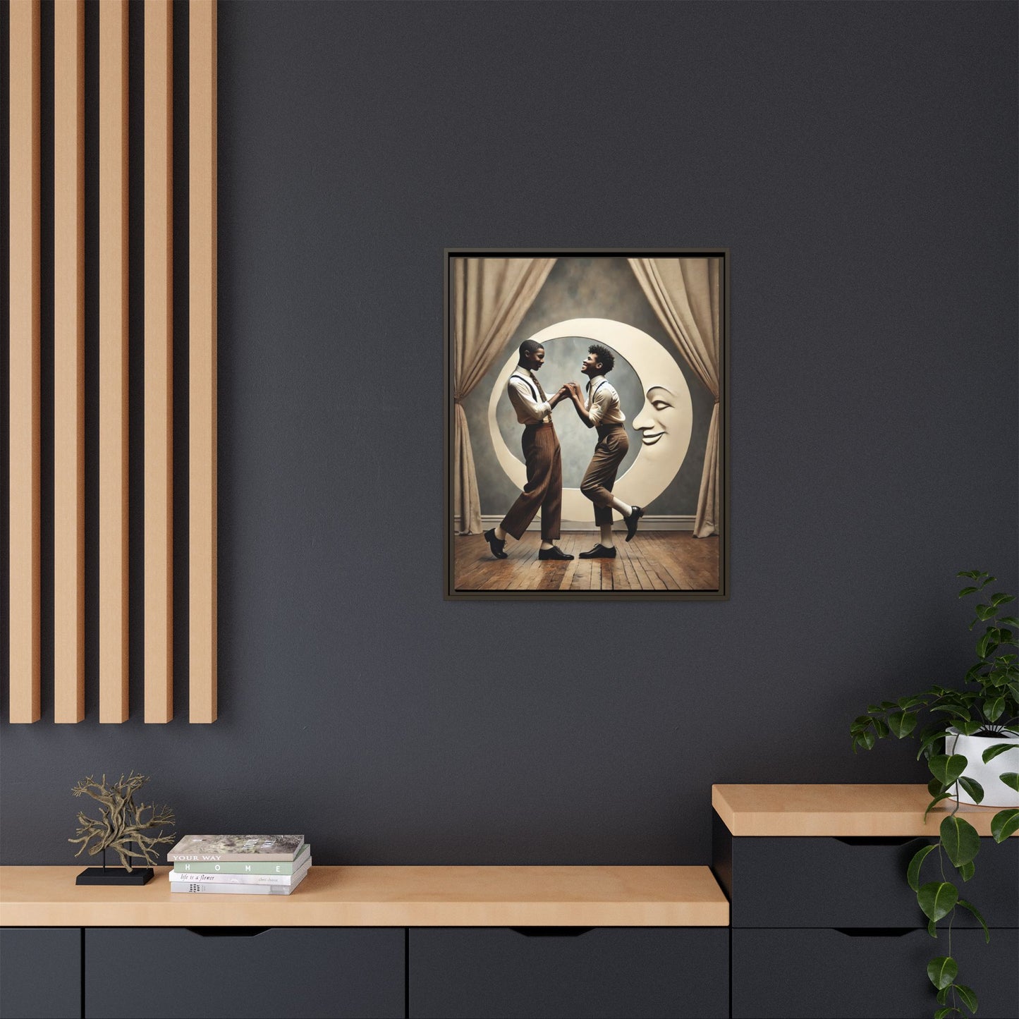 Two joyful young Black men dressed in 1920s fashion dancing in front of a crescent moon prop with a smiling face. This artwork reclaims erased queer love, offering a whimsical and powerful celebration of Black LGBTQ+ youth and history.