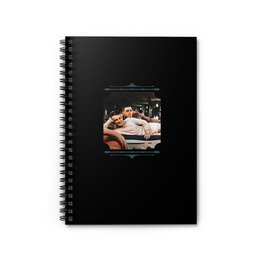 Spiral notebook featuring a vintage photo of two young gay soldiers reclining affectionately in a barracks.