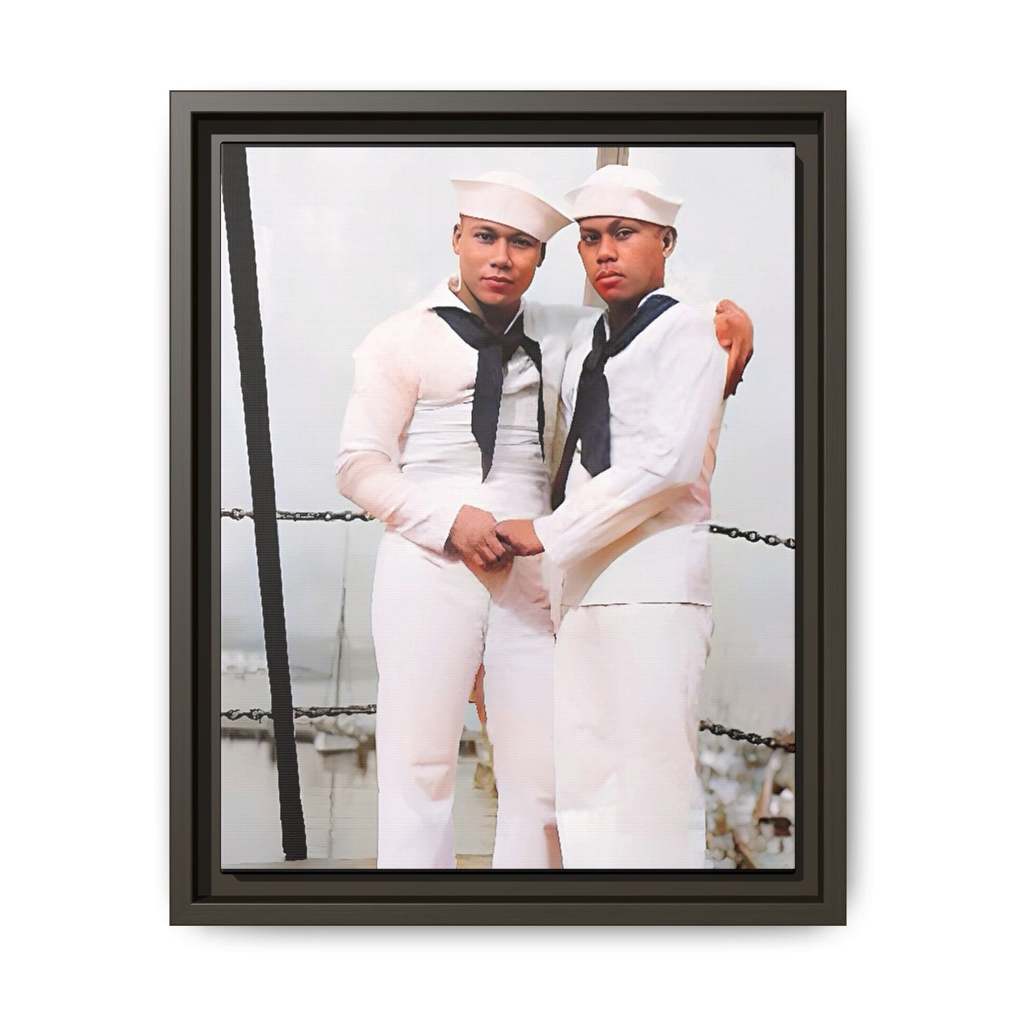 A restored vintage photograph of two Navy sailors standing together aboard a naval ship at Apra Harbor, Guam. Dressed in crisp white uniforms, their hands gently clasped, the image captures a quiet moment of strength, devotion, and LGBTQ+ military history.