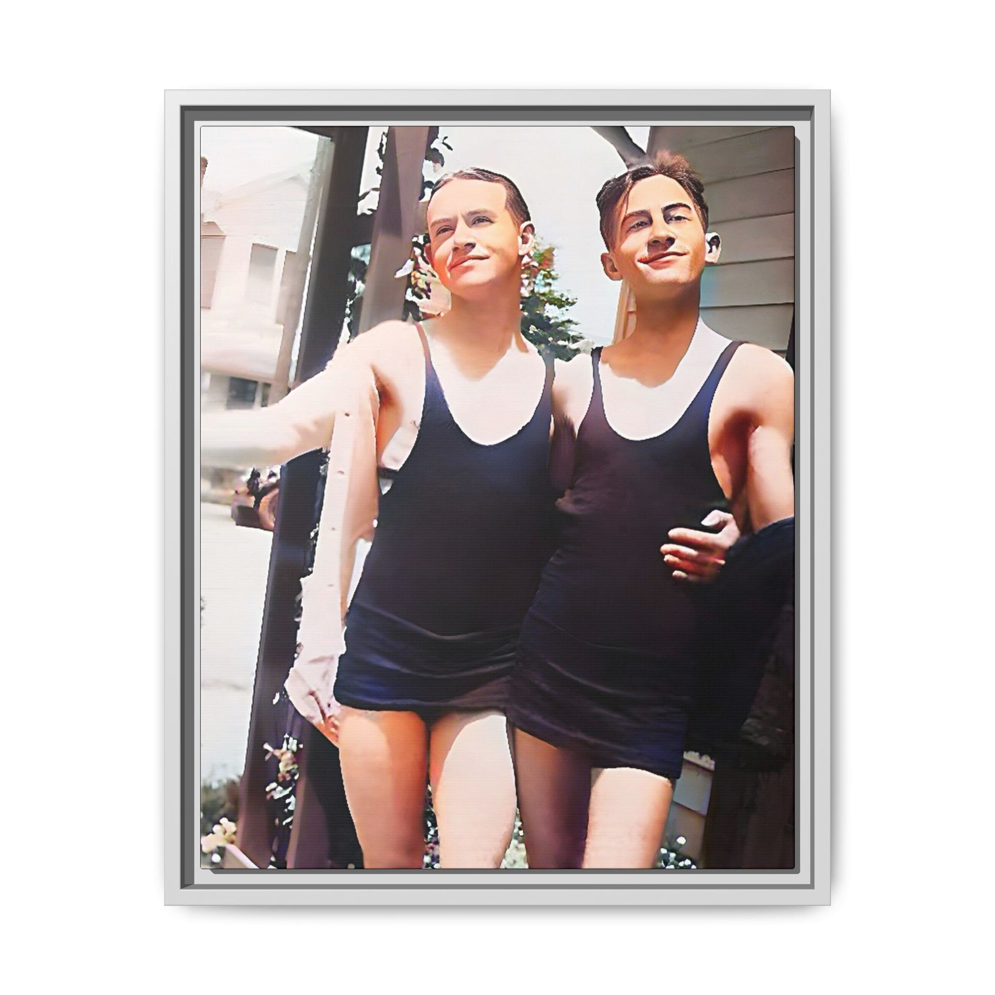 A beautifully restored vintage beach photo of two friends, Lee and Clifford, in classic black swimsuits, walking along Ocean Grove, New Jersey. Their smiles and relaxed body language capture the carefree joy of 1920s summer days, set against a charming coastal backdrop. Gay Couple