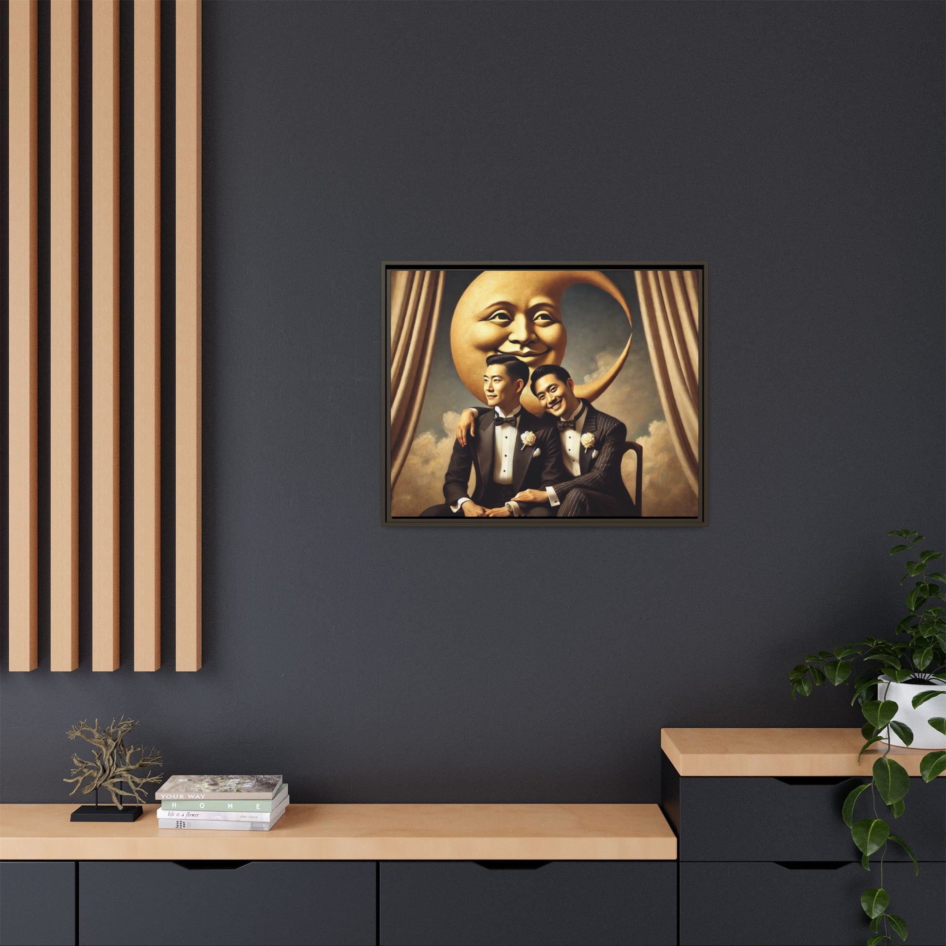 Vintage-inspired artwork of a romantic gay Asian couple in tuxedos sitting affectionately beneath a smiling crescent moon prop, surrounded by vintage stage curtains and dreamy clouds. A reclaimed queer narrative from the Man In The Moon series.