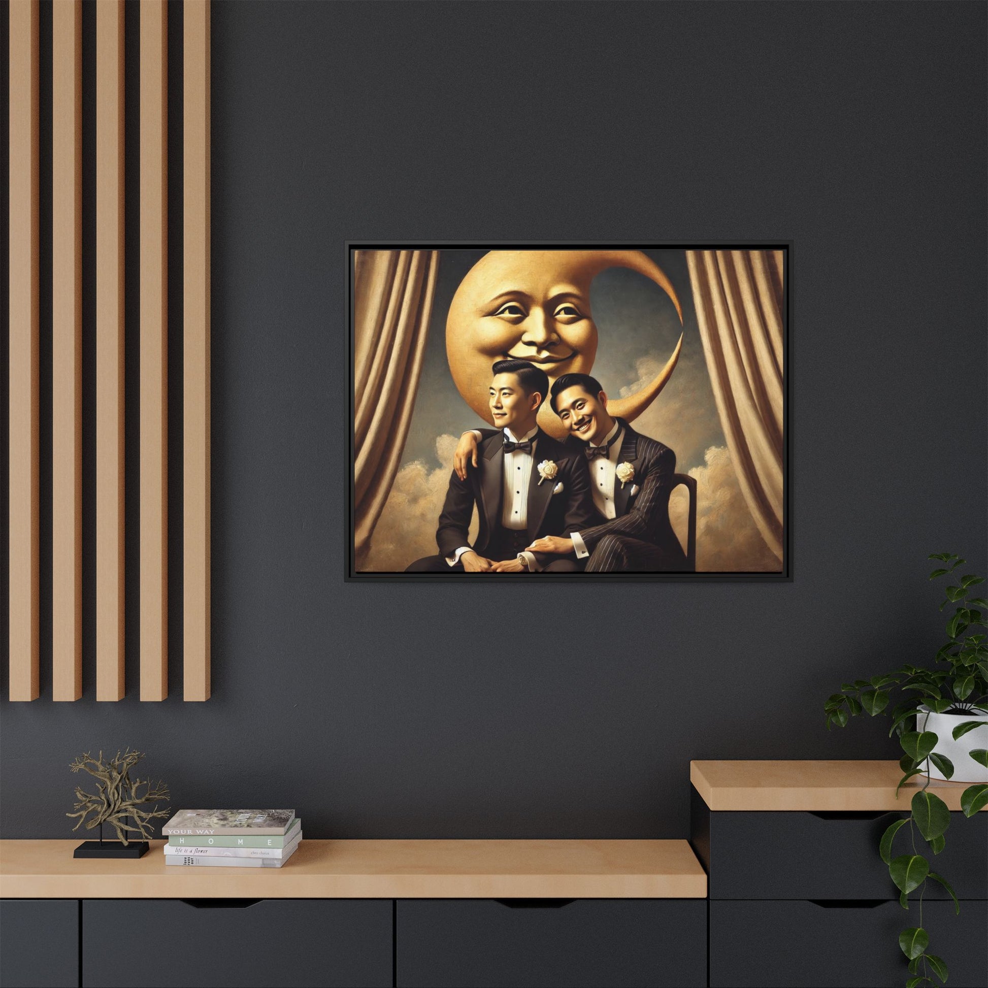 Vintage-inspired artwork of a romantic gay Asian couple in tuxedos sitting affectionately beneath a smiling crescent moon prop, surrounded by vintage stage curtains and dreamy clouds. A reclaimed queer narrative from the Man In The Moon series.