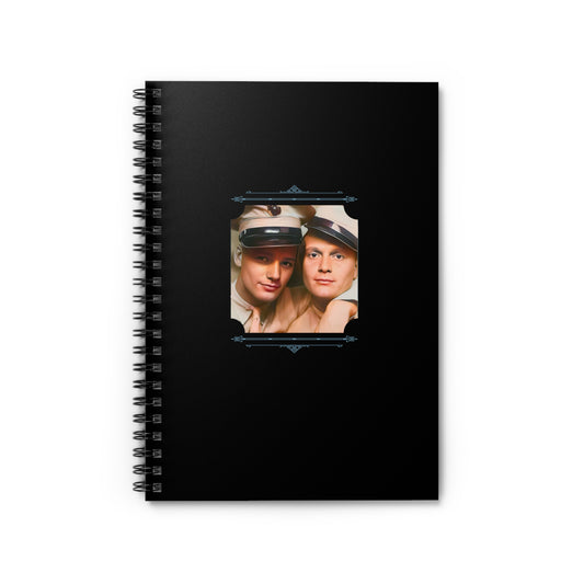 Spiral notebook with black cover featuring a restored WWII photo booth image of two US Marines in uniform